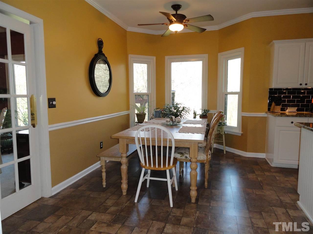 3520 Ribcowski Court Raleigh, NC 27616 - Photo 7 of 25 a view of a dining room with furniture and a chandelier