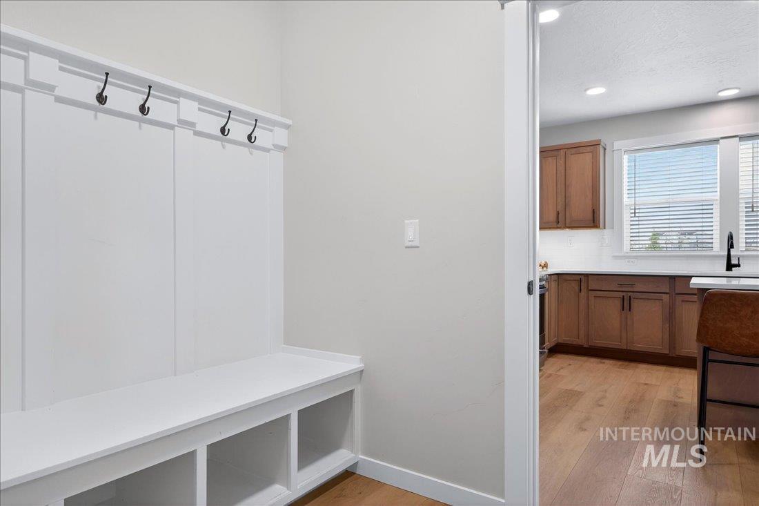 1993 North Perth Court Middleton, ID 83644 - Photo 21 of 45 Mudroom with light wood-style flooring, a textured ceiling, and recessed lighting