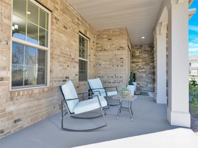 a outdoor living space with patio furniture and potted plants