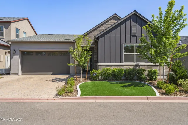 a view of backyard with a garden and entertaining space