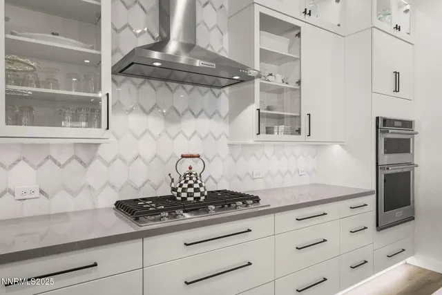 a close view of a stove a microwave and cabinets in the kitchen