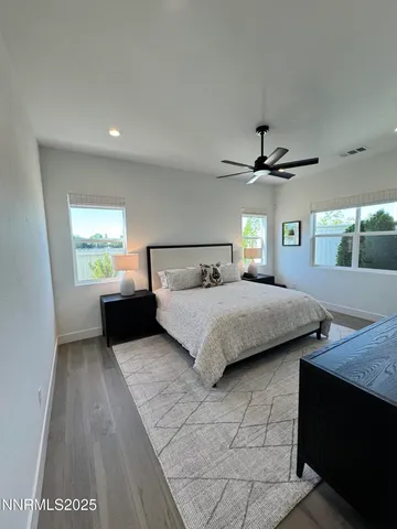 a bedroom with a bed and a couch