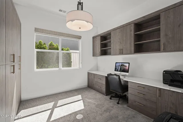 a workspace with furniture and a window