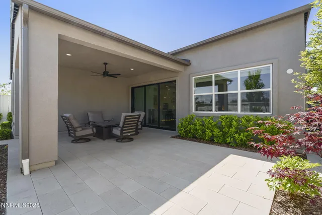 a view of a house with sitting area and garden