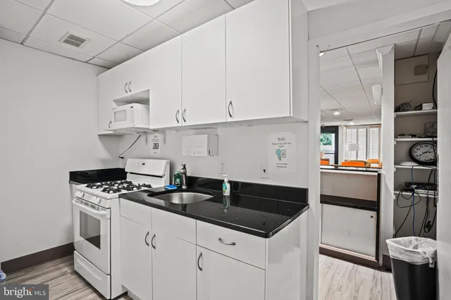 a utility room with a sink a washer and dryer