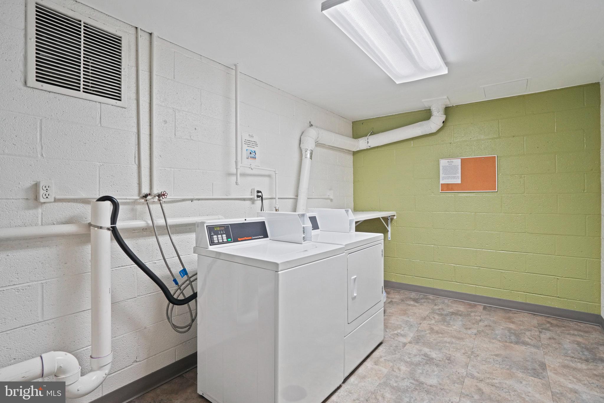 4242 East W Highway, Unit 605 Chevy Chase, MD 20815 - Photo 29 of 46 a utility room with a sink a washer and dryer