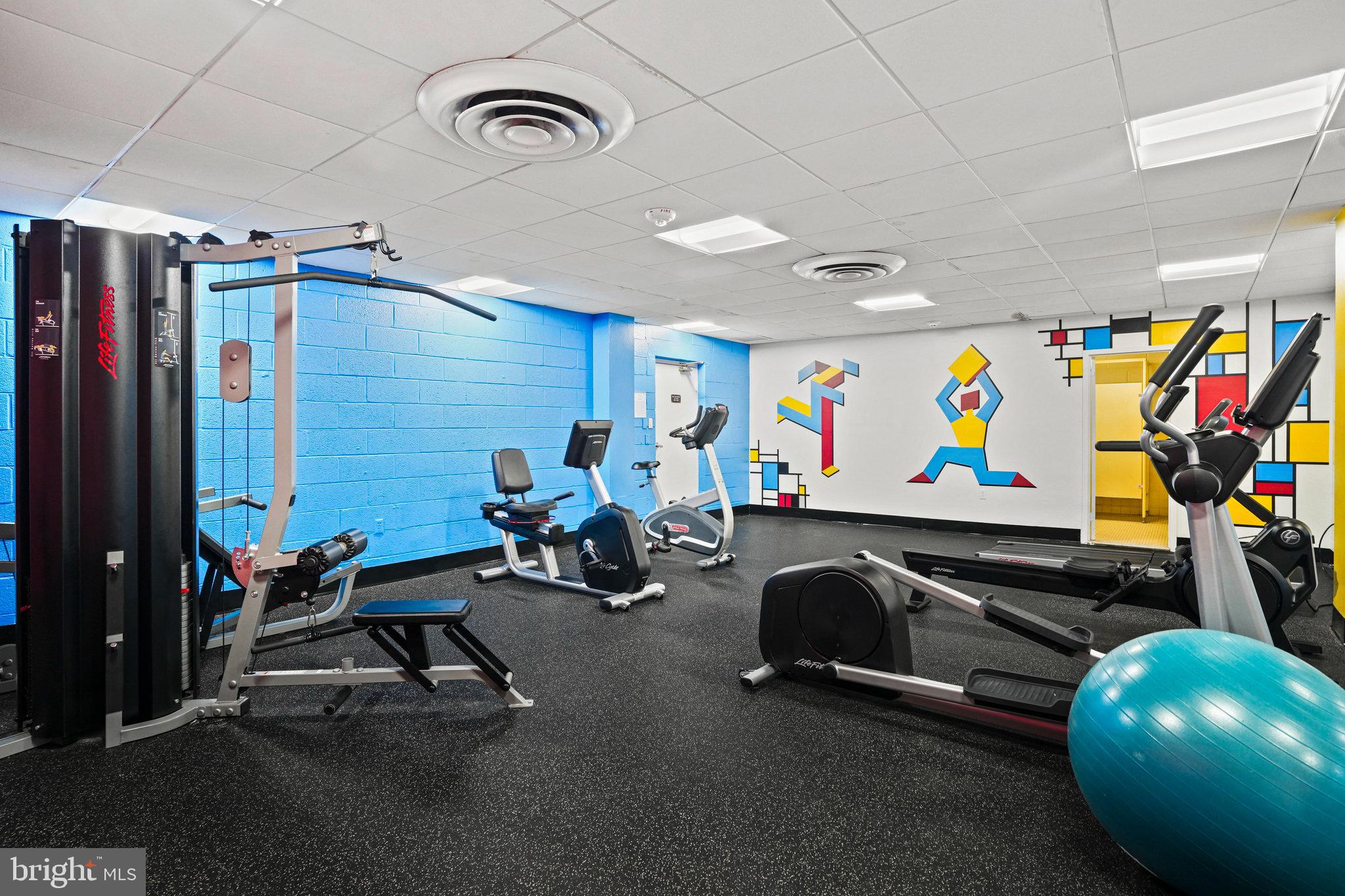 4242 East W Highway, Unit 605 Chevy Chase, MD 20815 - Photo 31 of 46 a view of a room with gym equipment