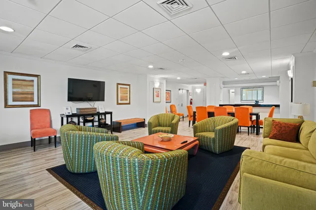 a kitchen with kitchen island a sink appliances and a counter top space