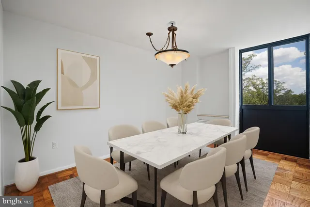 a view of a dining room with furniture window and wooden floor