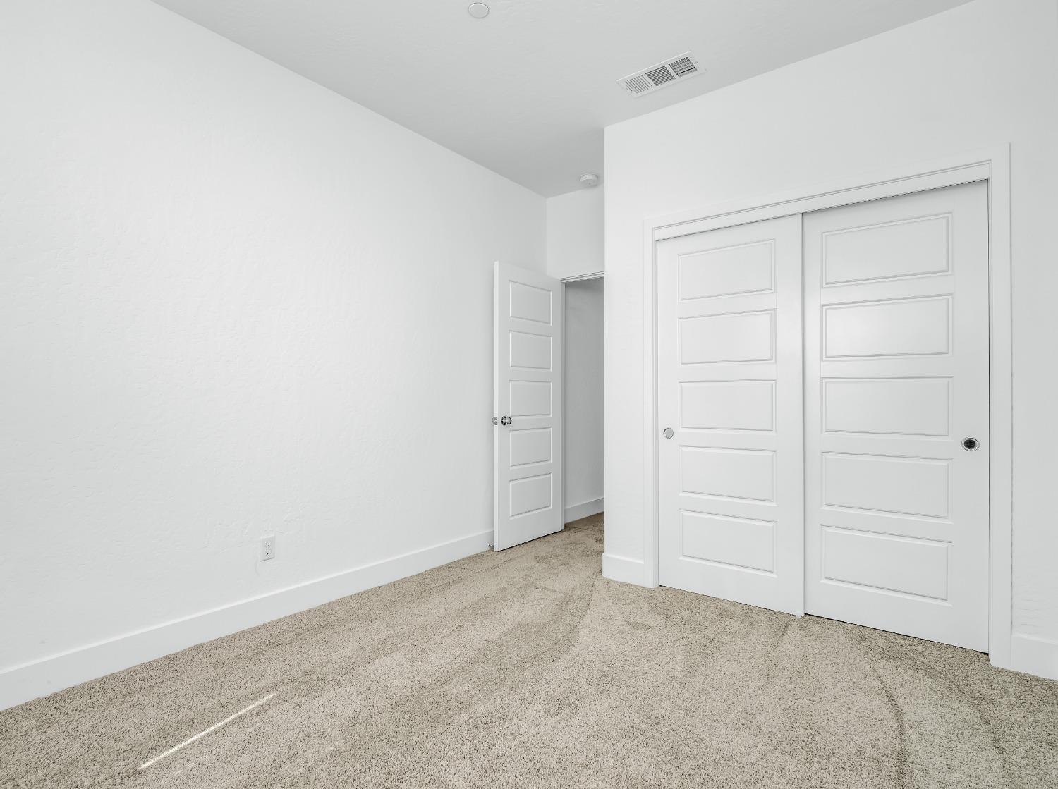 2734 East Teaberry Drive Fresno, CA 93730 - Photo 15 of 34 an empty room with closet area