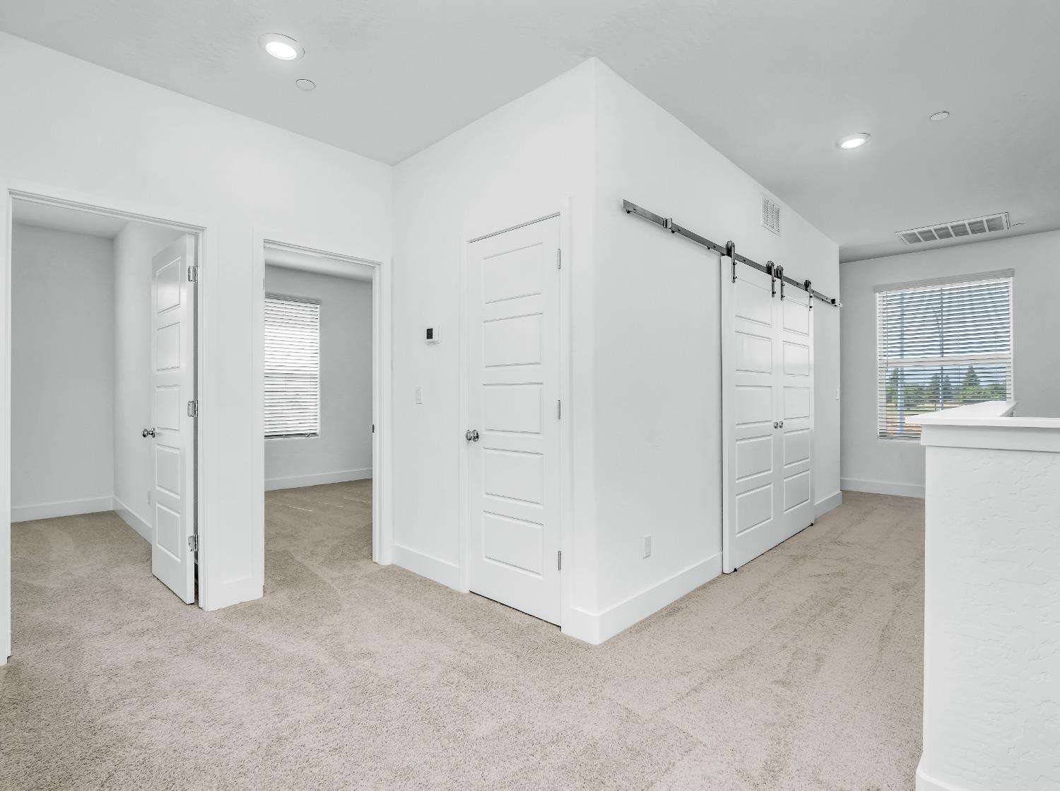 2734 East Teaberry Drive Fresno, CA 93730 - Photo 16 of 34 an empty room with windows and closet