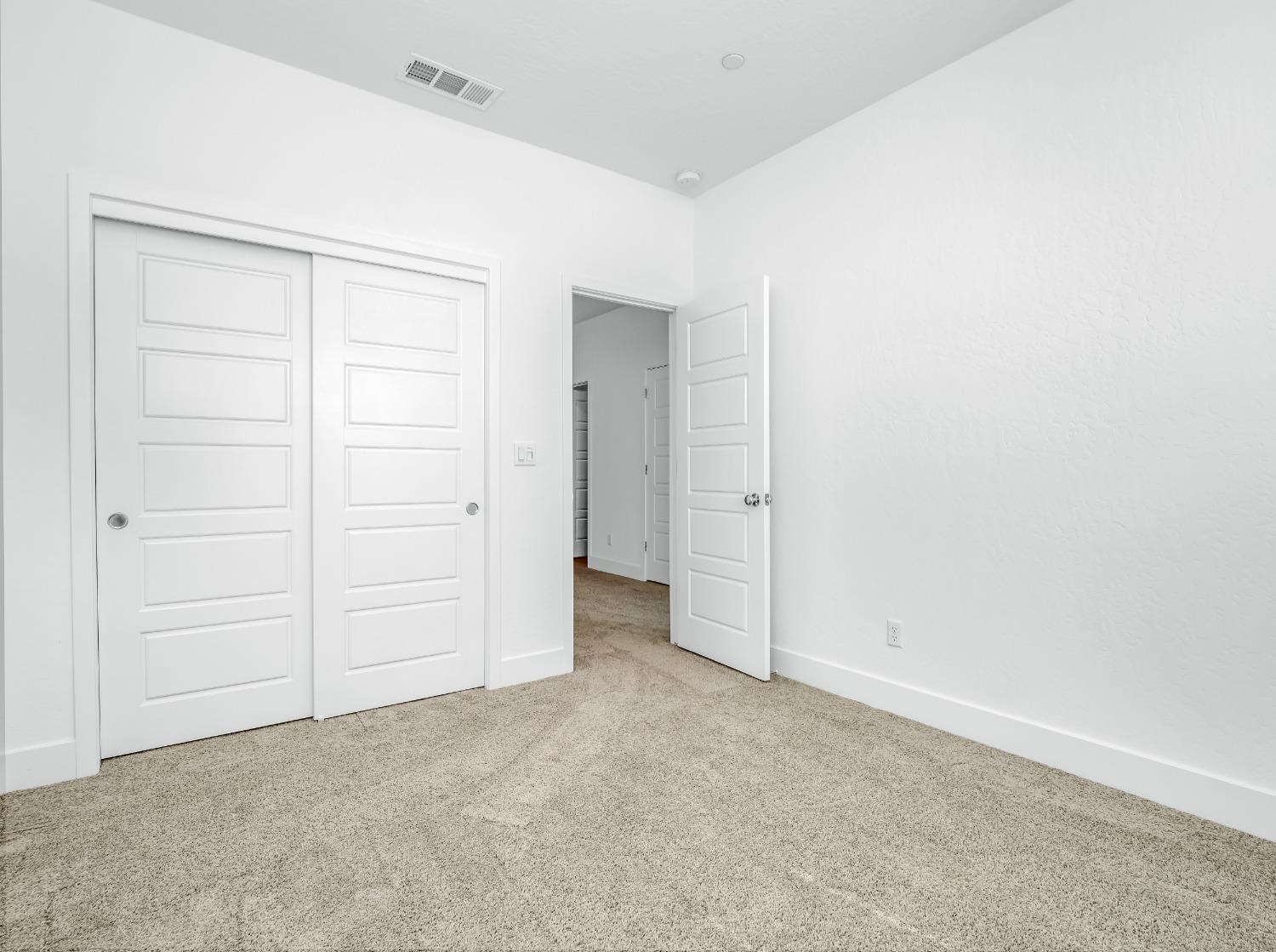 2734 East Teaberry Drive Fresno, CA 93730 - Photo 18 of 34 an empty room with closet area