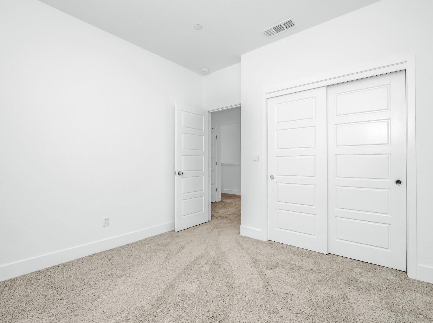 2734 East Teaberry Drive Fresno, CA 93730 - Photo 20 of 34 an empty room with closet area