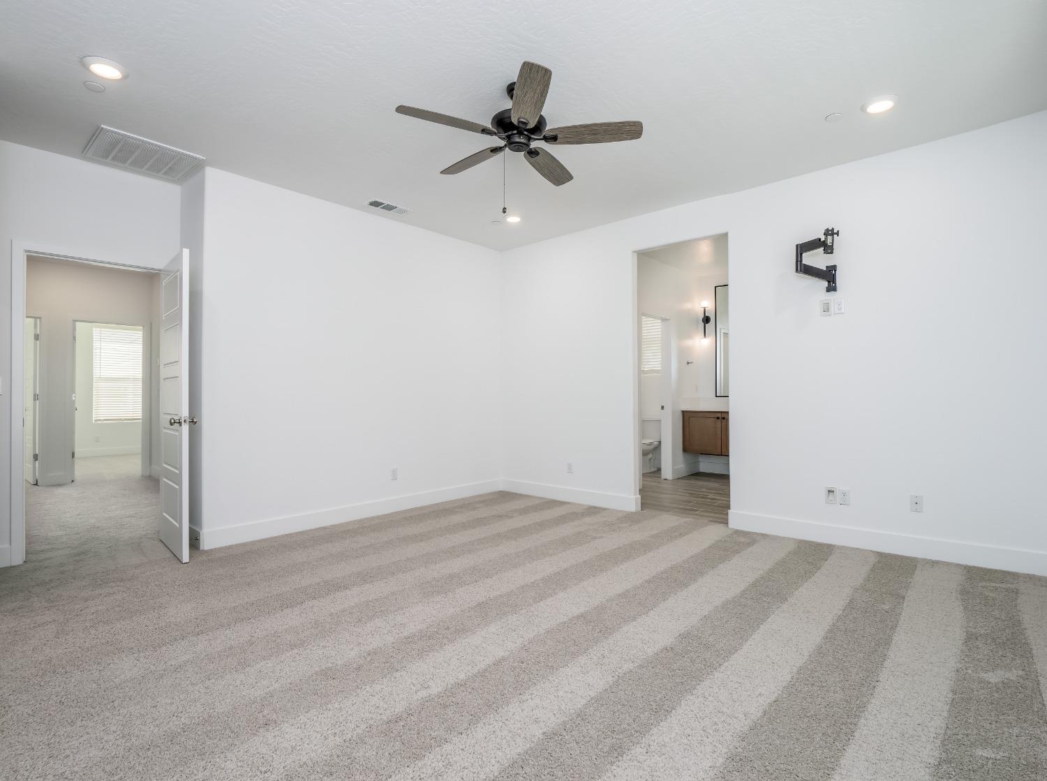 2734 East Teaberry Drive Fresno, CA 93730 - Photo 25 of 34 wooden floor in an empty room with a window