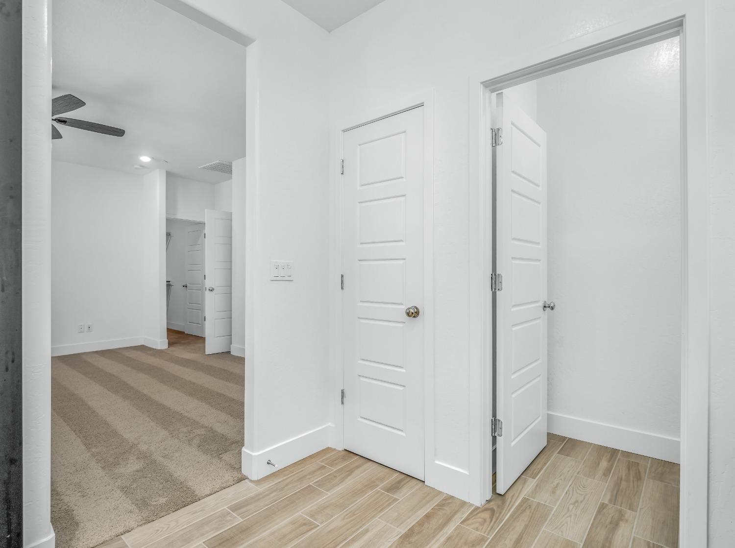 2734 East Teaberry Drive Fresno, CA 93730 - Photo 28 of 34 wooden floor and white doors in a room
