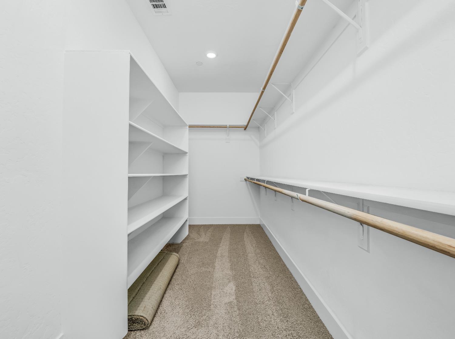 2734 East Teaberry Drive Fresno, CA 93730 - Photo 30 of 34 a view of an empty walk in closet