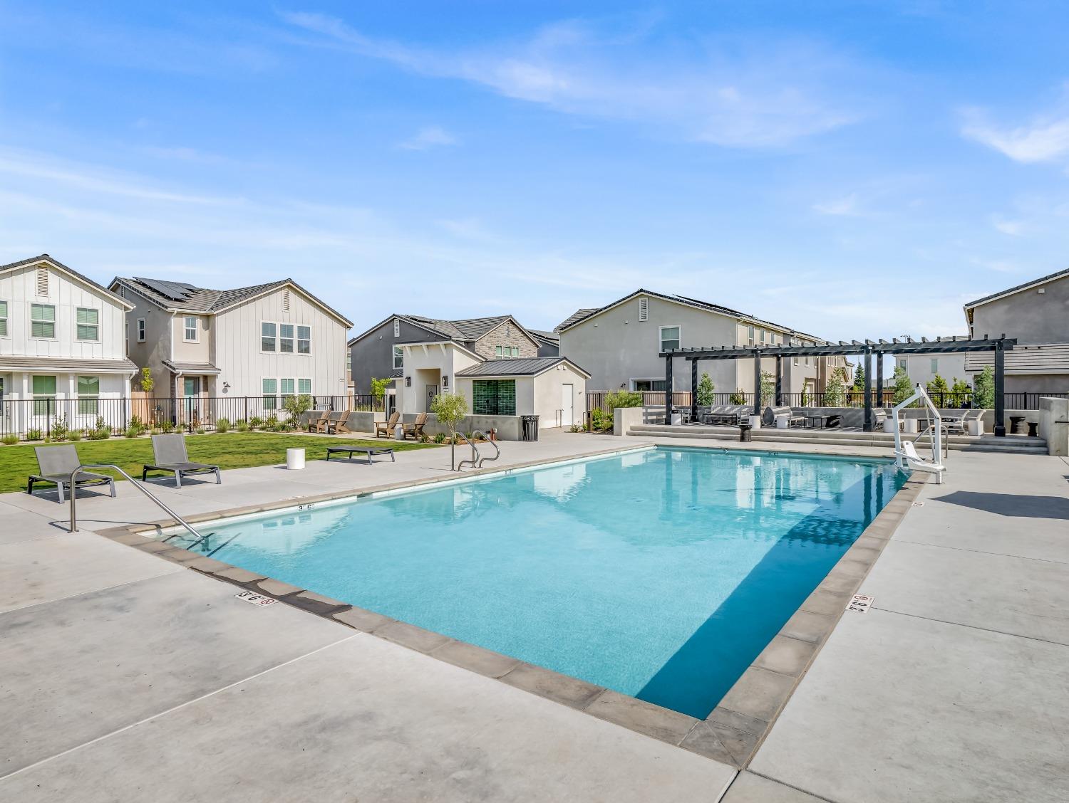 2734 East Teaberry Drive Fresno, CA 93730 - Photo 33 of 34 a view of a house with swimming pool