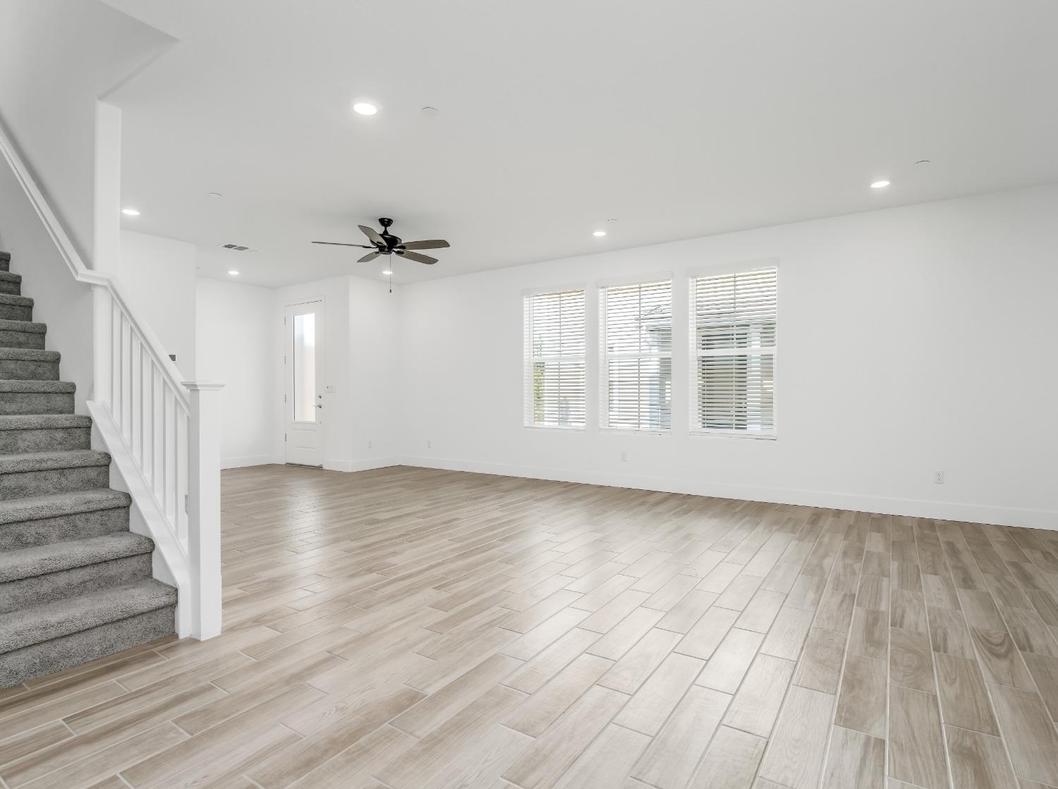 2734 East Teaberry Drive Fresno, CA 93730 - Photo 4 of 34 wooden floor in an empty room with a window