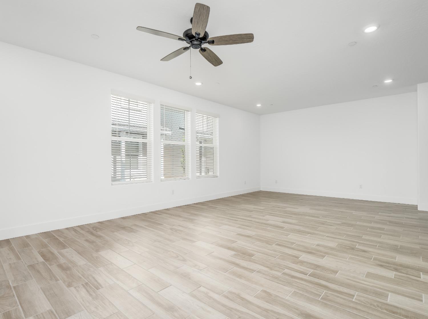 2734 East Teaberry Drive Fresno, CA 93730 - Photo 5 of 34 a view of an empty room with a window