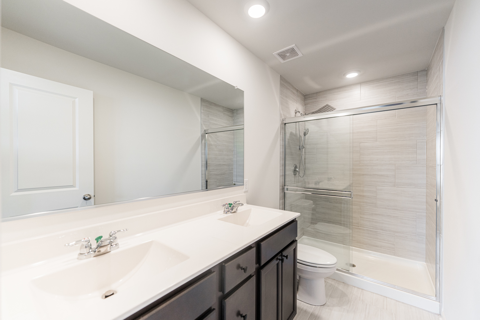 2016 Yellowstone Boulevard Mundelein, IL 60060 - Photo 16 of 30 a bathroom with a sink a toilet and shower