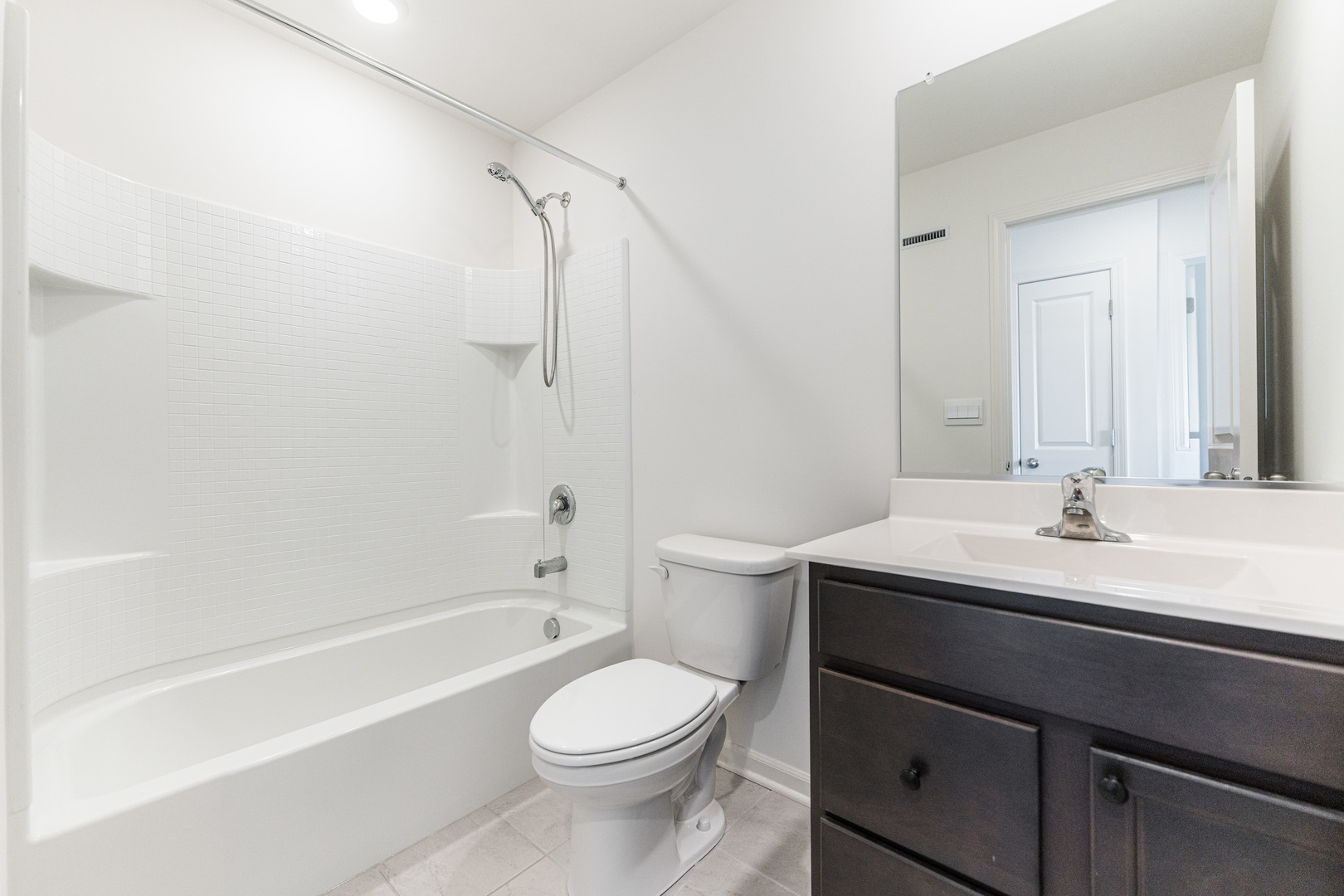 2016 Yellowstone Boulevard Mundelein, IL 60060 - Photo 23 of 30 a bathroom with a sink a toilet and shower