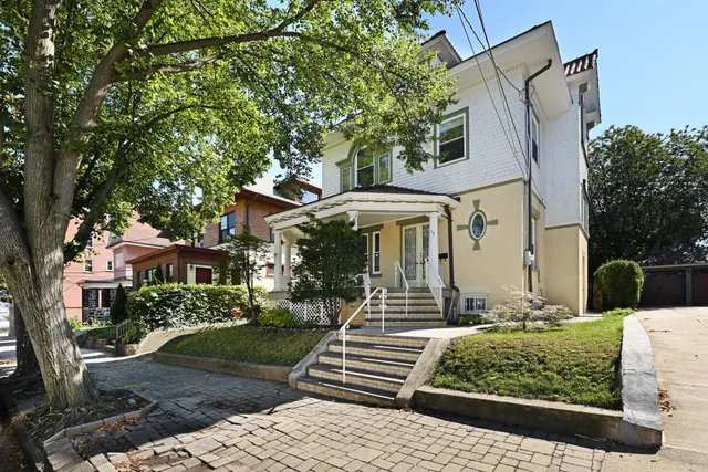 front view of a house with a yard