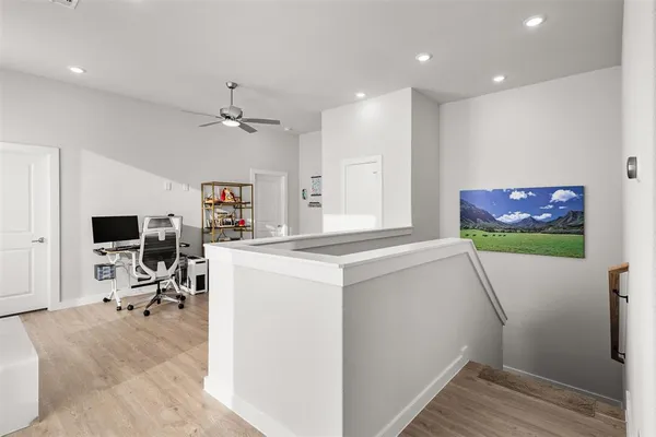 a view of livingroom with workspace and a window