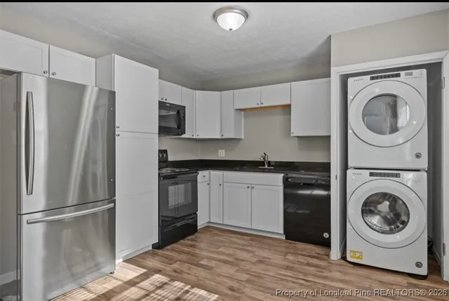 a kitchen with a refrigerator sink and washer