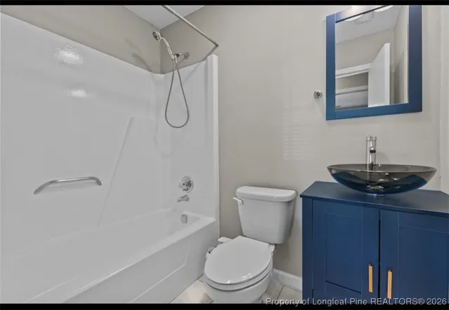 a bathroom with a toilet a sink and bathtub