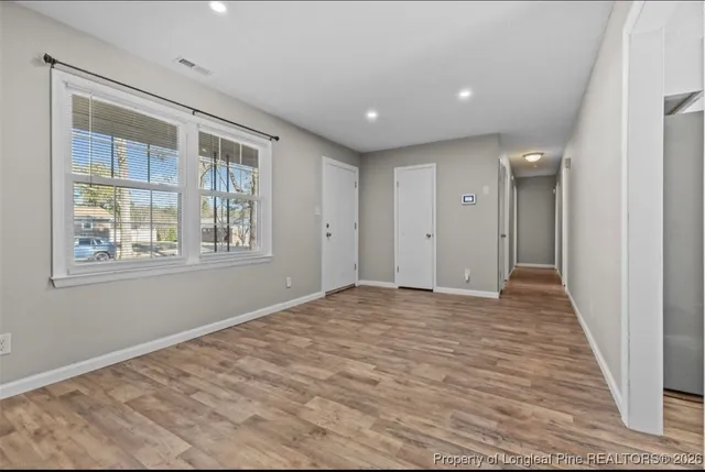 a view of empty room with windows