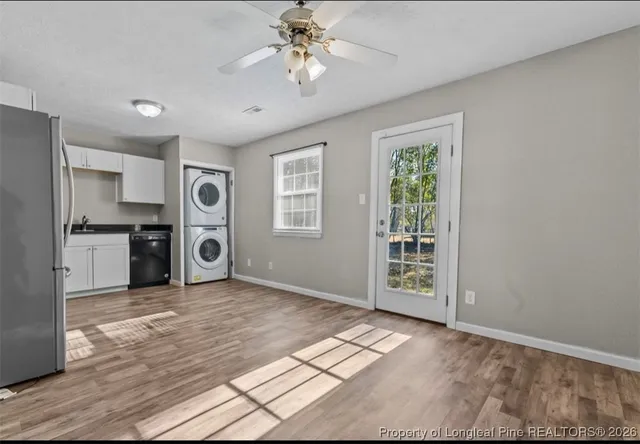 a view of a kitchen with a stove cabinets and wooden floor