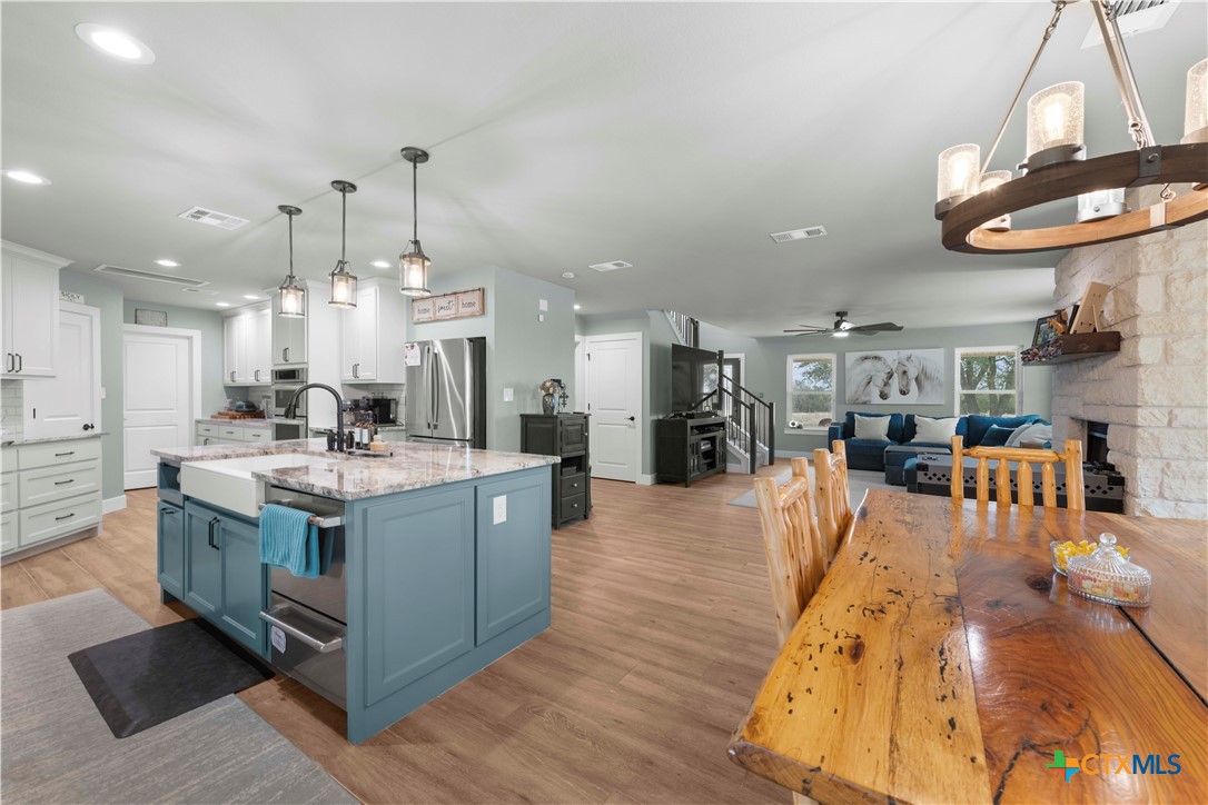 8901 Brewer Lane Salado, TX 76571 - Photo 14 of 30 a large kitchen with kitchen island a large island in it