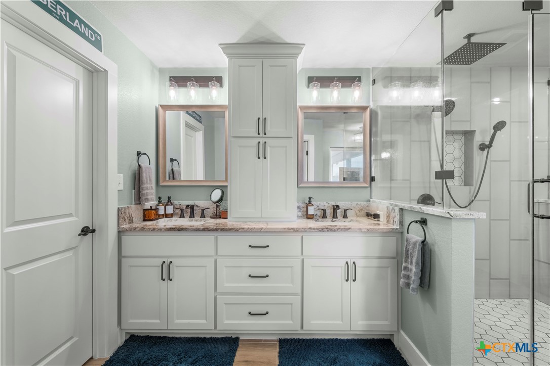 8901 Brewer Lane Salado, TX 76571 - Photo 17 of 30 a bathroom with a double vanity sink mirror and double