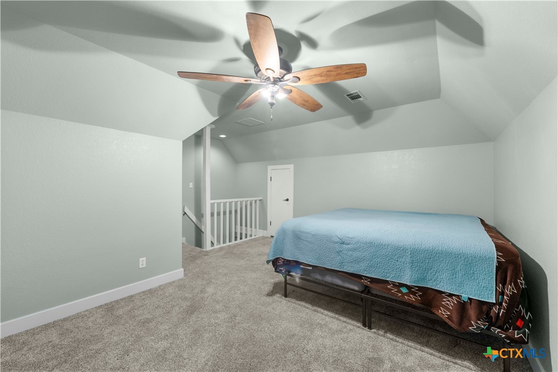 8901 Brewer Lane Salado, TX 76571 - Photo 19 of 30 a bedroom with a bed and a ceiling fan