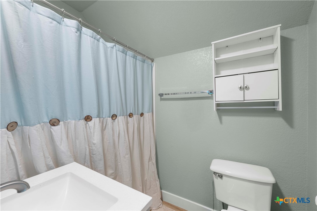 8901 Brewer Lane Salado, TX 76571 - Photo 20 of 30 a white toilet sitting next to a white sink