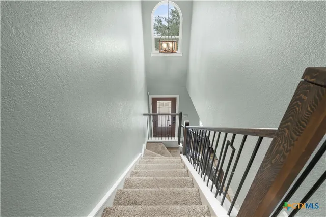 a bedroom with bed and window