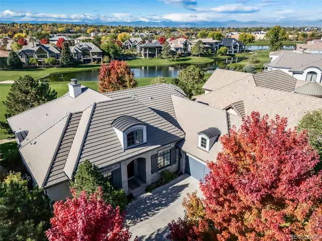 an aerial view of a house with a lake view