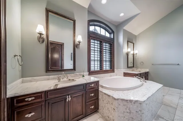 a bathroom with a sink double vanity and a mirror