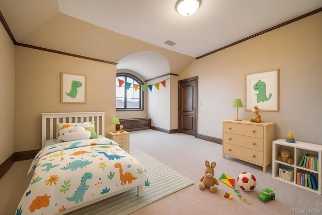 a bedroom with a bed and a dresser in it