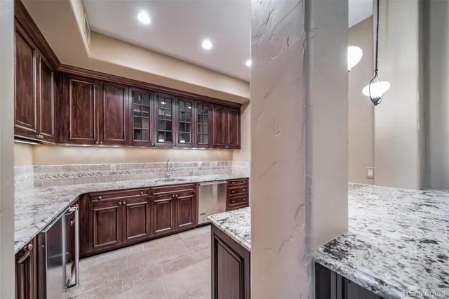 a kitchen with stainless steel appliances granite countertop a stove and a sink