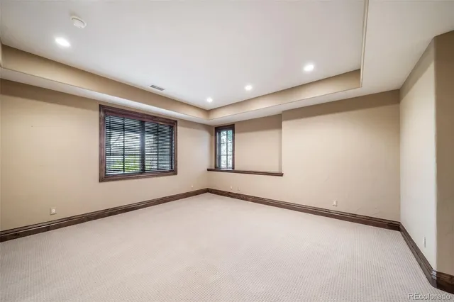 a bathroom with a sink a large mirror and a bathtub