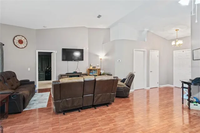 a kitchen with stainless steel appliances a stove microwave and sink