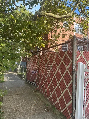 a backyard of a house with a tree