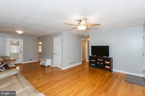 a bedroom with furniture and a flat screen tv