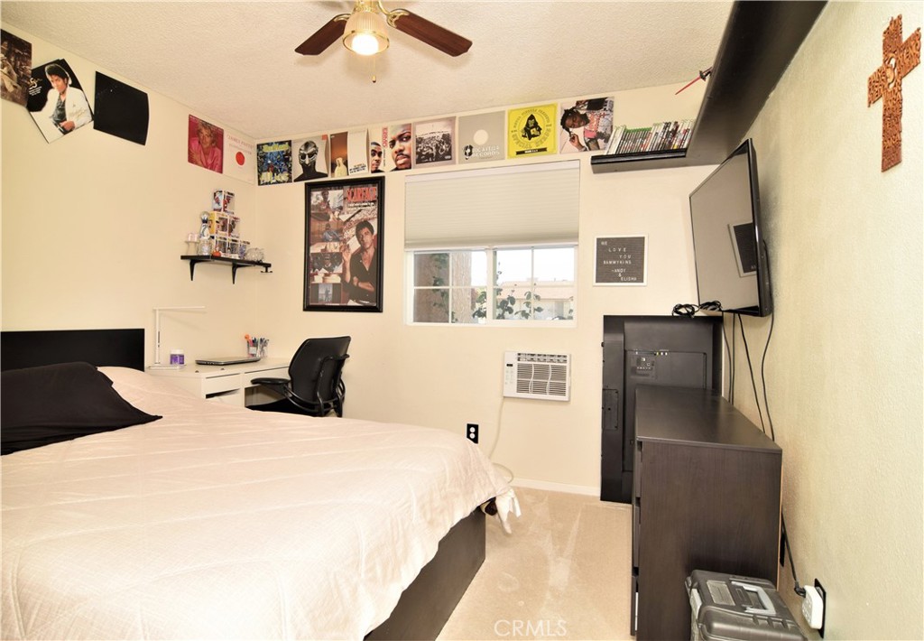 39334 Willowvale Road Palmdale, CA 93551 - Photo 14 of 21 a bedroom with a bed and a couch