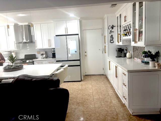 39334 Willowvale Road Palmdale, CA 93551 - Photo 3 of 21 a kitchen with stainless steel appliances kitchen island granite countertop a sink stove and cabinets