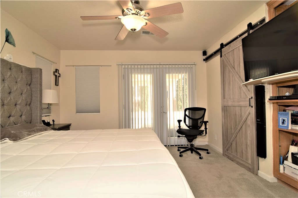 39334 Willowvale Road Palmdale, CA 93551 - Photo 10 of 21 a bedroom with furniture and a window