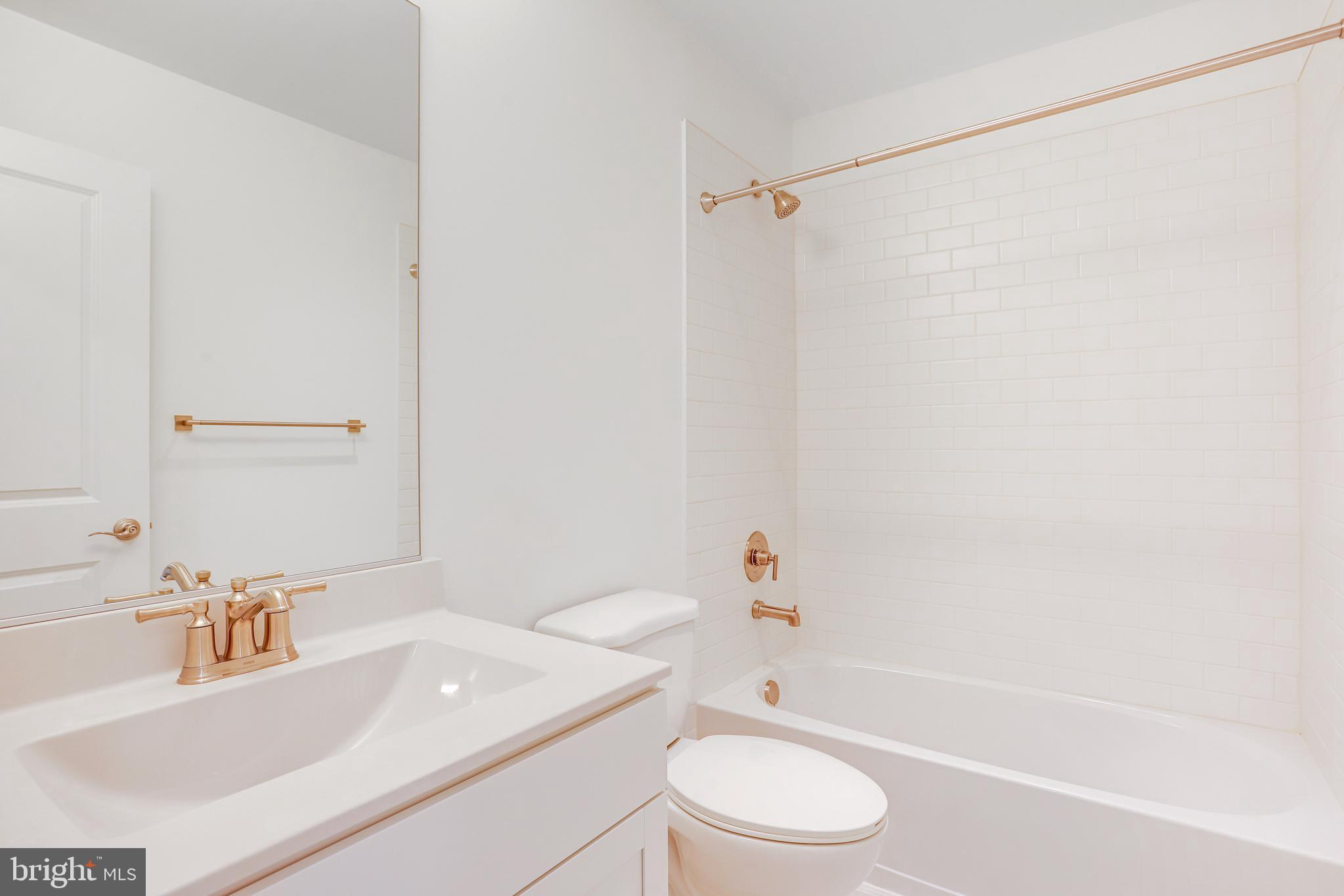 1889 Shookstown Road Frederick, MD 21702 - Photo 41 of 47 a bathroom with a sink a toilet and a bathtub