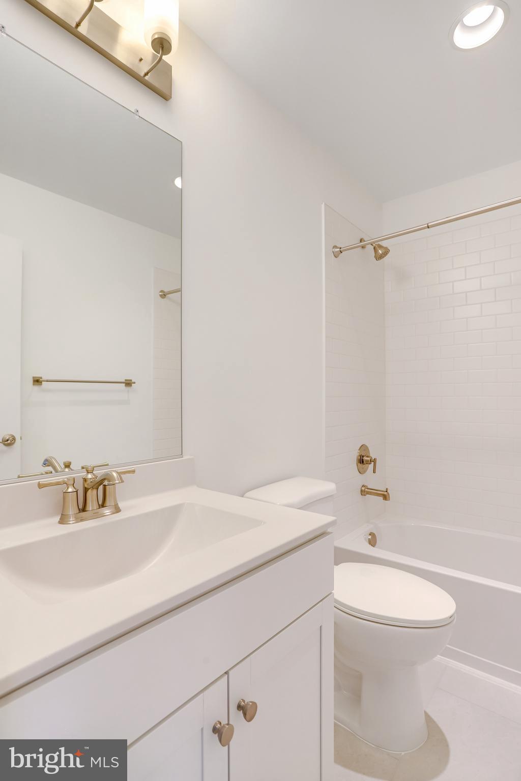 1889 Shookstown Road Frederick, MD 21702 - Photo 42 of 47 a bathroom with a sink a toilet and a mirror