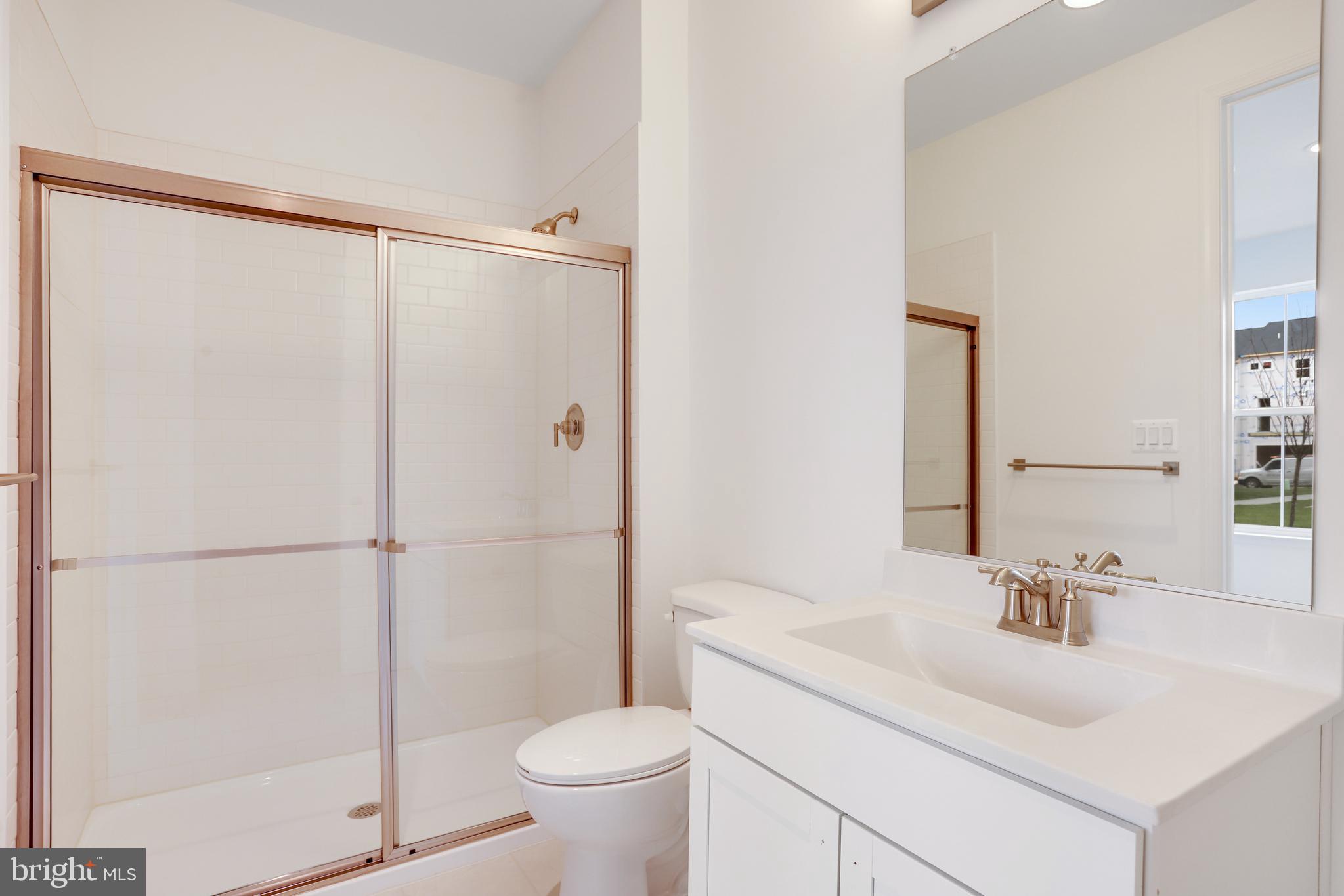 1889 Shookstown Road Frederick, MD 21702 - Photo 8 of 47 a bathroom with a sink a toilet and shower